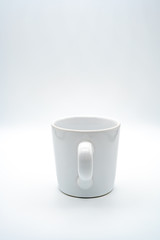 White coffee cup There is a glass handle on the center With a white background, isolated