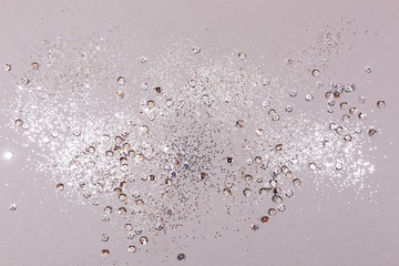 Gray background with silver sparkles and sequins, christmas concept festive texture for your design.