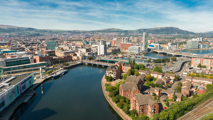 Aerial view on river and buildings in City center of Belfast Northern Ireland. Drone photo, high angle view of town  - obrazy, fototapety, plakaty