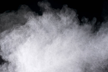 White powder explosion isolated on black background 