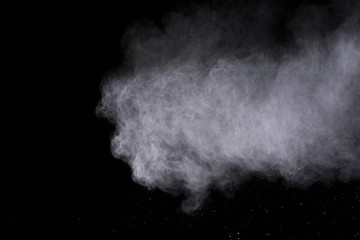 White powder explosion isolated on black background 