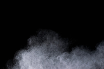 White powder explosion isolated on black background 