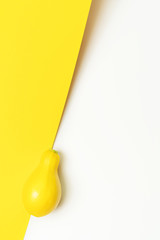 Butternut pumpkin background on vibrant yellow and white backdrop. Flat lay style. Halloween, harvest and fall concept.