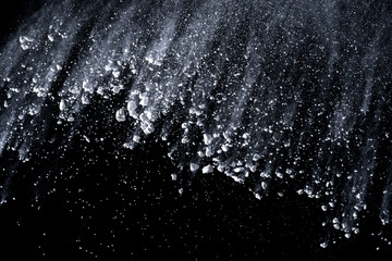 White powder explosion isolated on black background 