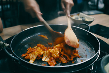 Cooking Korean spicy pork on pan