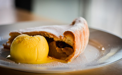 home made apple strudel  with vanilla ice cream