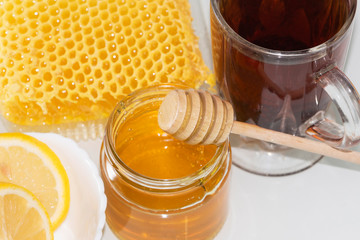 Tea with lemon and honey. The honey in the comb.