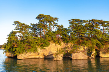 Matsushima Bay in dusk, beautiful islands covered with pine trees and rocks. One of the Three Views of Japan, and is also the site of the Zuigan-ji, Entsu-in and Kanrantei. in Miyagi Prefecture, Japan