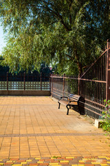 Bench on the embankment of the river