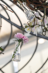 Selective focus flowers in glass bottles hang on the air.Home decoration concept.