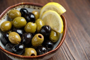 Olives and olives with lemon. menu for catering