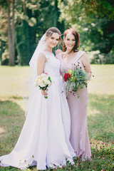 Beautiful girls Bride and bridesmaid with bouquets