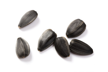 Collection of black sunflower seeds isolated on white, clipping path