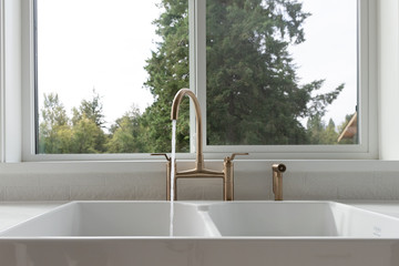 Modern gold faucet in kitchen