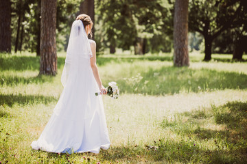 Girl in a white dress leaves