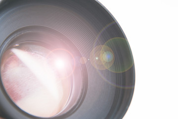 small lens with flare on white background close-up space for text