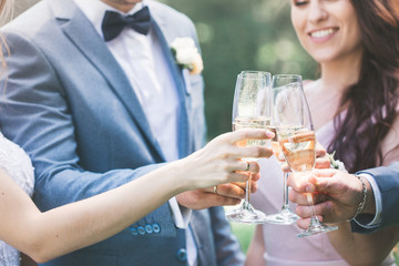 Hands with glasses, close-up