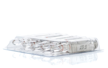 transparent ampoules for injection with medicine in package on a white background