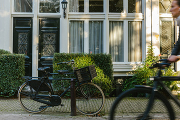 Fototapeta premium Bicycle parked on a bridge above the water in Amsterdam