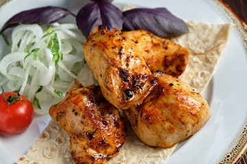 Skewers of chicken with thin pita bread . catering menu
