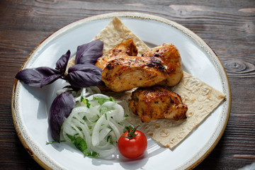 Skewers of chicken with thin pita bread . catering menu