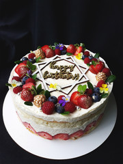cream cake with fruit and the inscription