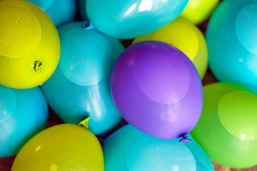 Сloseup of Colorful balls filled with water. Many water balloons prepared for the water party on birthday.