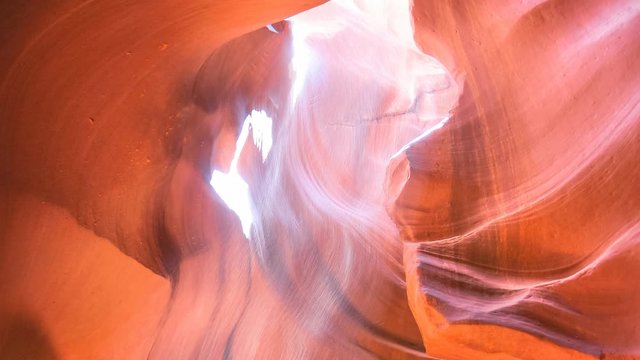 Antelope Canyon cinemagraph with rays of light at midday. Antelope slot canyon is located east of Page town in United States, Arizona on Navajo land. It's the USA most photographed natural wonder.