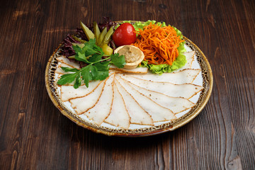 Sliced lard with canned vegetables. catering menu
