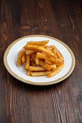 French fries on a white plate. catering menu