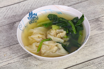 Asian traditional Wonton soup with herbs