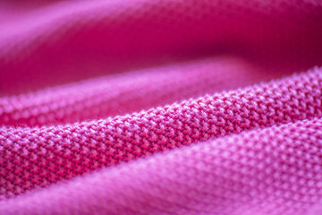 Fototapeta na wymiar Pink woolen fabric cloth background