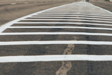 Double solid strip on the road. Two white stripes on the asphalt.