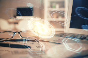 Crypto theme hologram with glasses on the table background. Concept of blockchain. Double exposure.