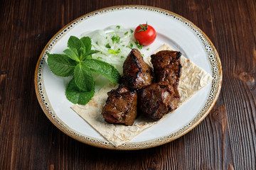 Beef skewers with thin pita bread . catering menu