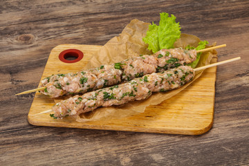 Raw minced pork skewer kebab for grill