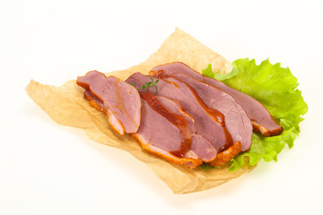 Sliced smoked duck breast served salad