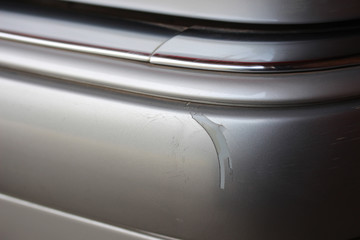 Damaged silver vehicle bumper