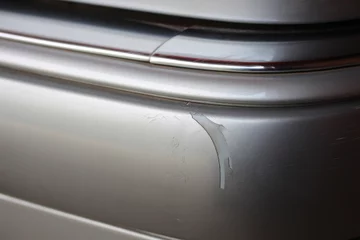 Deurstickers Damaged silver vehicle bumper © hanjosan
