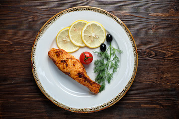 Grilled salmon steak with side dish . catering menu