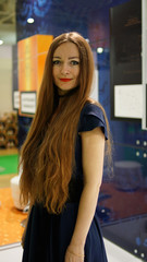 Portrait of a young woman office worker with long hair