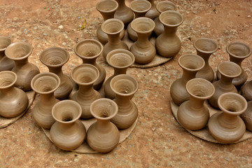 Handmade terracotta pots. Clay pots before painting. Craftsmanship.