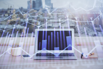 Financial market graph hologram and personal computer on background. Multi exposure. Concept of forex.