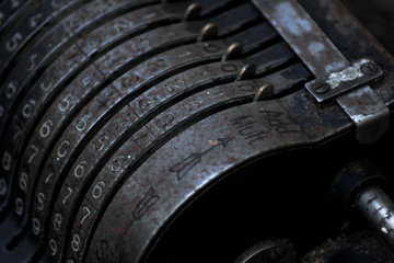 An old vintage cash register with lots of numbers