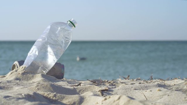 Plastic bottle near the sea. Ecology concept.
