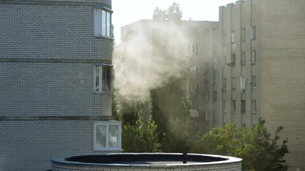 Clouds of grey smoke coming from the window of a burning apartment. 4K
