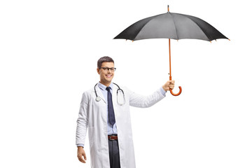 Young male doctor holding an open umbrella © Ljupco Smokovski
