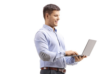 Man in formal clothes holding a laptop computer