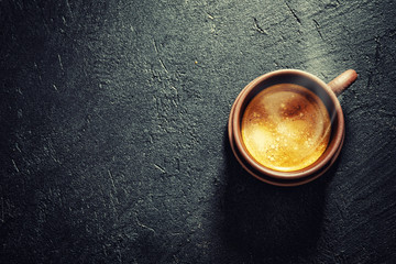 Cup of fresh made coffee served in cup