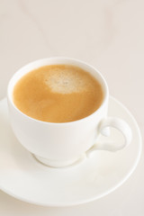 cup of black coffee on a white background